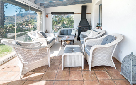 Smart retractable glass panels opening to gardens